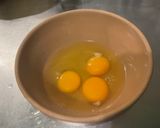 A picture of step 8 of Scrambled Eggs with Green Peppers, Red Onion, and Coulommiers Cheese.