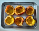 A picture of step 2 of Baked Peaches with Amaretti, Dark Chocolate, Ice Cream and Mint.