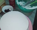 A picture of step 6 of Vanilla cream cake with chocolate chips inside.