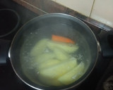 Foto del paso 4 de la receta: Merluza empanada con papas cocidas, zanahoria y huevo duro