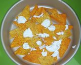 A picture of step 4 of Loaded Cheesy nachos.