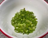 A picture of step 3 of Pork Chops with Zesty Green Onion Salsa.