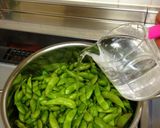 A picture of step 2 of The Best Way to Boil Edamame with Just 1/2 Cup Water.