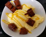 A picture of step 3 of My Sons Dairy Ice cream with Bueno Chocolate bar & Syrup 🤩.