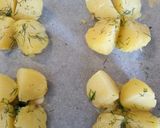 A picture of step 2 of Pan fried salmon on an open jacket with dill and butter.