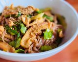 A picture of step 7 of Stir-Fried Brown Rice Pho with Octopus & Mustard Greens.