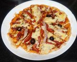 A picture of step 6 of Italian pizza.