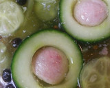 A picture of step 4 of Pickled Cucumber stuffed with Spam.