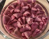 A picture of step 1 of Chicken Hearts Yakitori style (no skewer) Leek Green on top.