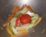 A picture of step 1 of Veg clear soup with sliced boiled egg.