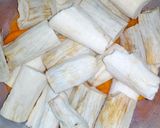 A picture of step 3 of Cassava steamed in semi ripe pawpaw. #4weekschallenge.