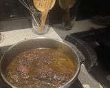 A picture of step 4 of Fesenjan (Persian Pomegranate Walnut Stew) with Chicken Thighs and Crispy Tahdig Rice.