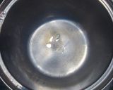 A picture of step 1 of Cardamom and tulsi tea.