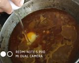 A picture of step 6 of Egg pouch curry.