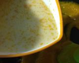 A picture of step 3 of Mango flavoured milk cake in two layers.