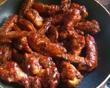A picture of step 8 of Sticky orange wings.