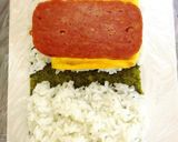 A picture of step 6 of Spam and Egg Onigiri with Tartar Sauce.