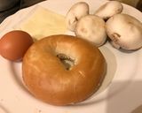A picture of step 1 of Fried Egg 🍳🥪Mushrooms 🍄 Melting Cheese Bagel🍩🍔.
