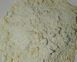 A picture of step 2 of Coconut mandazis.