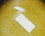 A picture of step 4 of Easy Butter Turmeric Rice in a Rice Cooker.