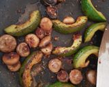 A picture of step 8 of My Buttered Salt n pepper Mushroomson,Advocado on bed of Spinach.