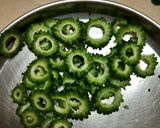 A picture of step 1 of Karela kathi mithi sabji.