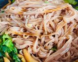 A picture of step 6 of Stir-Fried Brown Rice Pho with Octopus & Mustard Greens.