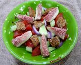 A picture of step 3 of Tomato, Cucumber, Fig, and Melekouni Salad.