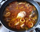A picture of step 6 of Chicken and Squid Paella.
