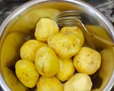A picture of step 1 of Kashmiri dum aloo.