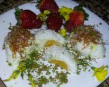 A picture of step 11 of Kunafa and Qashtalia Decorated with Oranges, Strawberries, and Bananas.