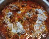 A picture of step 4 of Murgir Laal Jhol.
