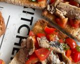 A picture of step 4 of Amalfi Bruschetta with Sardines, Piccolo Tomatoes & Basil.