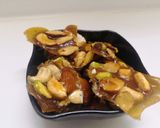 A picture of step 9 of Caramelized nuts chikki.