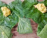 A picture of step 6 of Steamed poppy and mustard seeds in pumpkin leaves.
