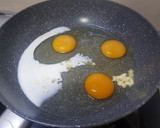 A picture of step 1 of Lazy Scrambled Eggs with Milk and Cheese.