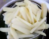 A picture of step 1 of Schezwan Chilli Potatoes with Jeera Rice.