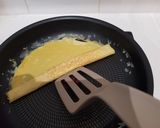Une image de l'étape 8 de Tamagoyaki (omelette japonaise sucrée).