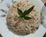 A picture of step 3 of Qeemay rice with shami kabab and vegetables salad.