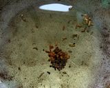A picture of step 4 of Baigun bodi(brinjal in dried lentil dumplings).