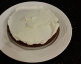 A picture of step 15 of Mocha Layer Cake with Whipped Mascarpone Cream and a Coffee Glaze Drizzle.