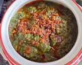 A picture of step 4 of Bathua saag tempered with ajwain,ginger & red chilli powder.