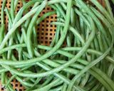 A picture of step 1 of Long beans poriyal.