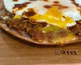 A picture of step 4 of Egg on Toastada with Chorizo Sauce 🤤.