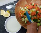 A picture of step 2 of Humus sandwich with rocket and crunchy bright salad.