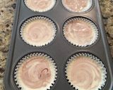 A picture of step 6 of Fudge Swirled Oreo Bottom Cheesecake Cupcakes.
