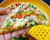 A picture of step 5 of Egg Pizza.