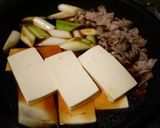 A picture of step 3 of Easy Meat Tofu with Store-Bought Sukiyaki Sauce.