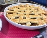 A picture of step 12 of Apple pie with flaky butter crust served with vanilla ice cream.