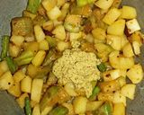 A picture of step 2 of Radish potato brinjal curry in mustard paste.